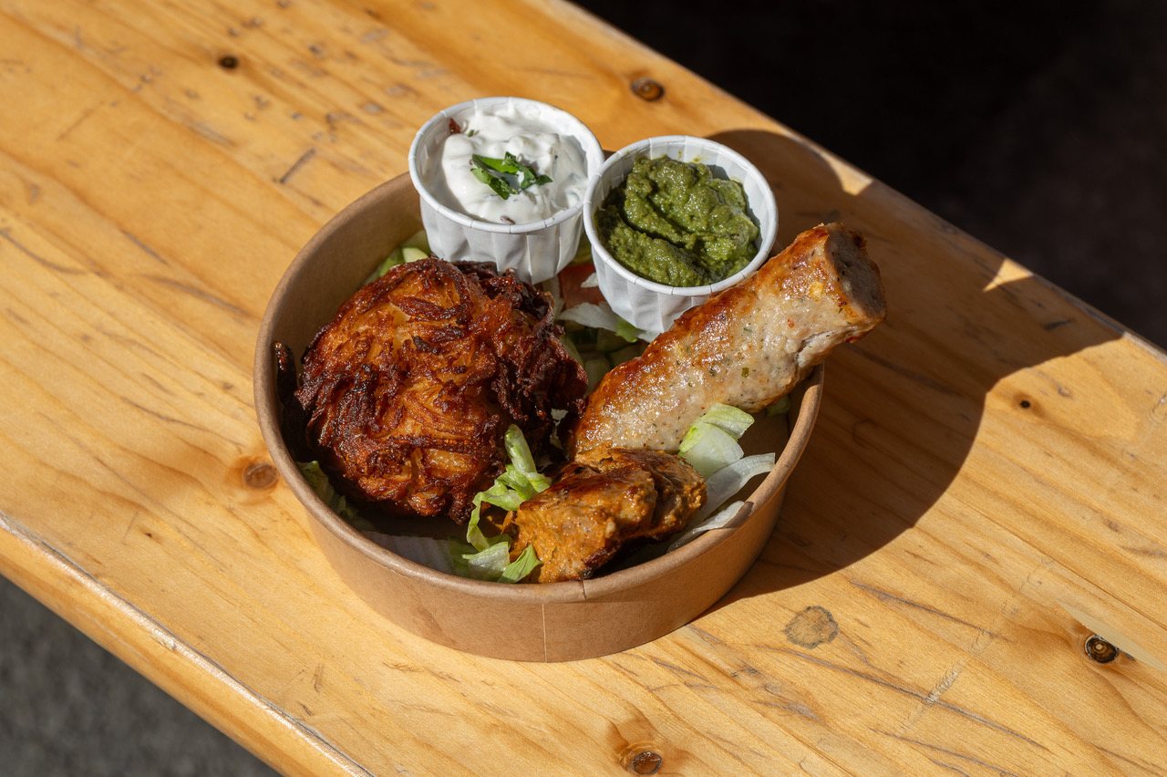 A Cegin Halfnhalf snack box of tikka, kebab and bhaji